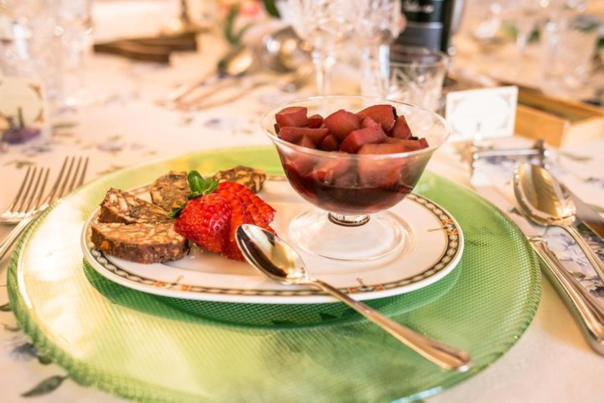 a plate of food with a bowl of strawberries and toast