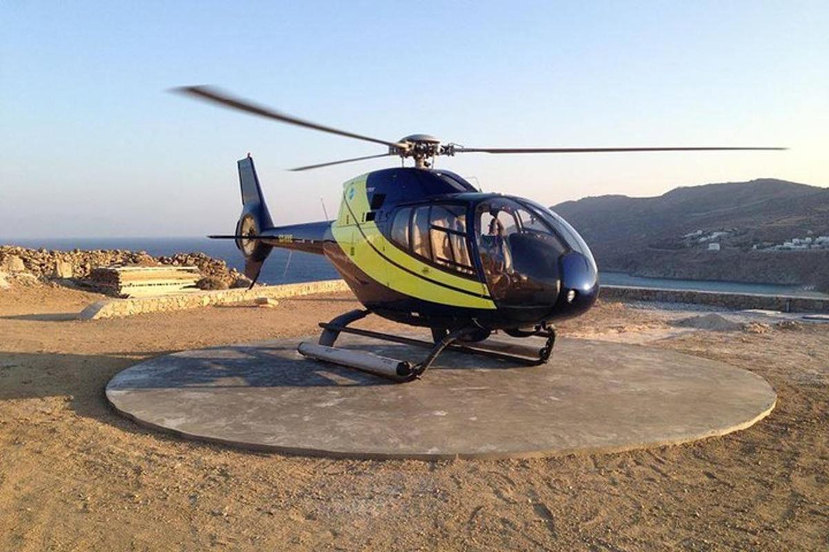 a helicopter is parked on top of a hill