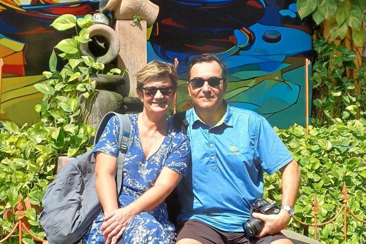 a man and a woman sitting on a bench
