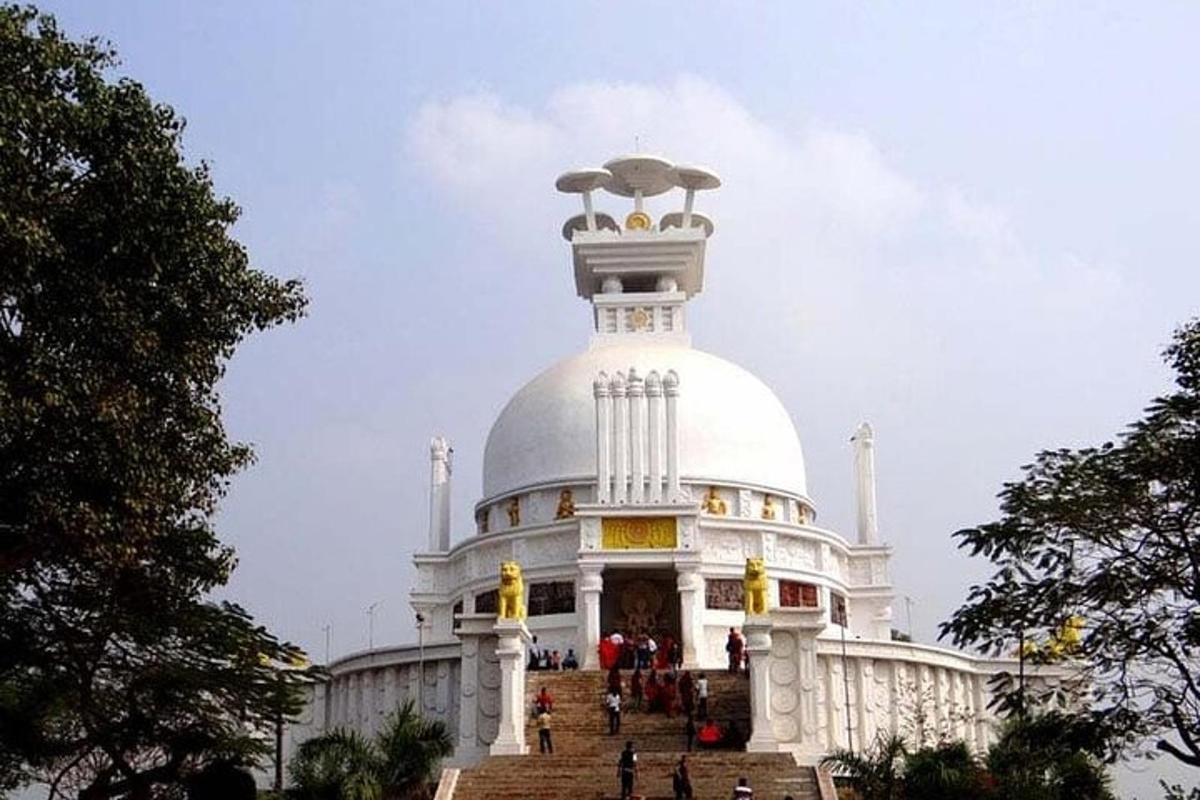 a large white building with people on top of it