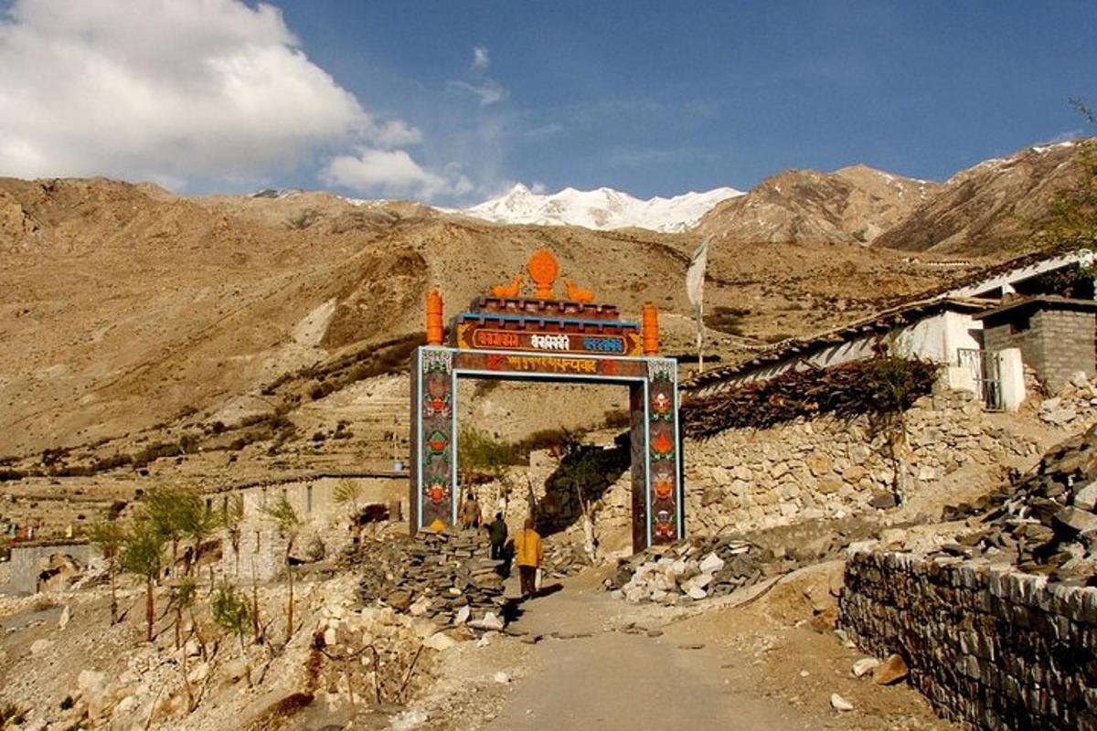 a person walking through a tunnel in a mountain