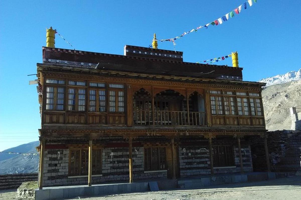 a large wooden building on top of a mountain