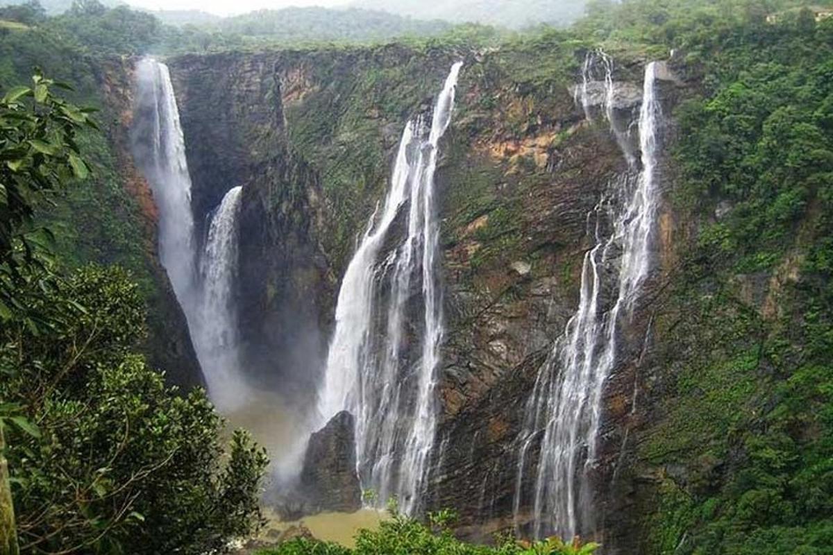 a waterfall on the side of a mountain