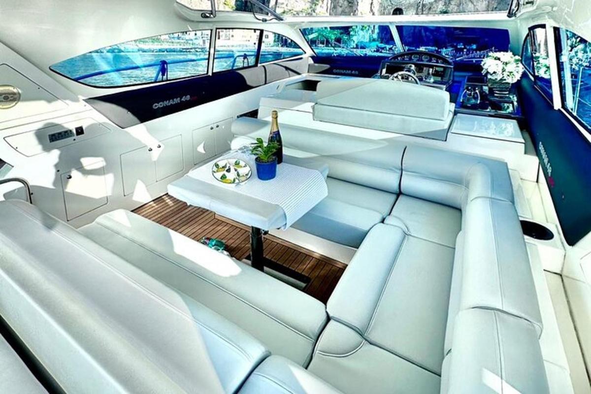 a luxury yacht with white seats and a table