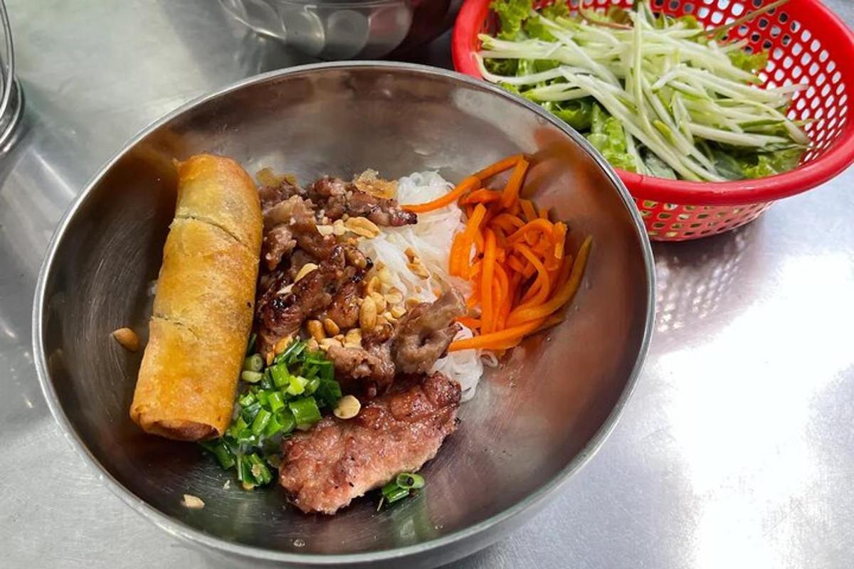 a bowl of food with meat and vegetables and a salad