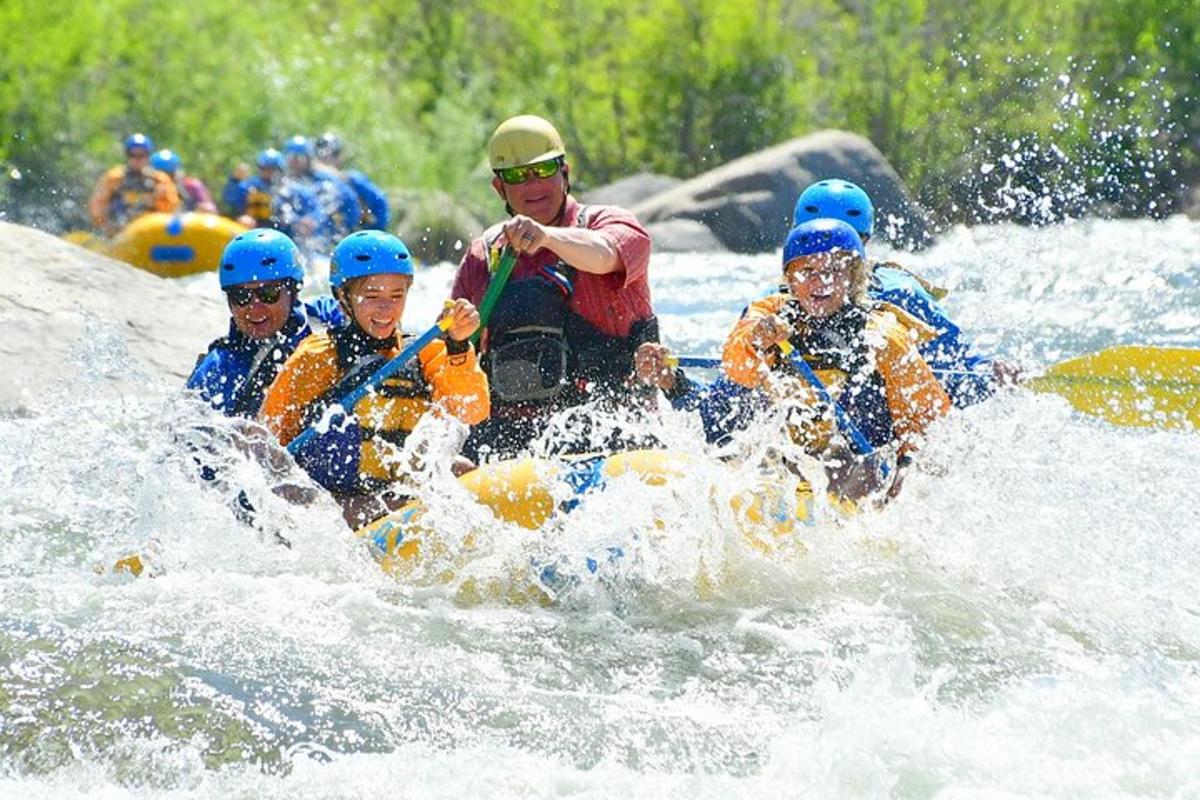a group of people rafting on a river