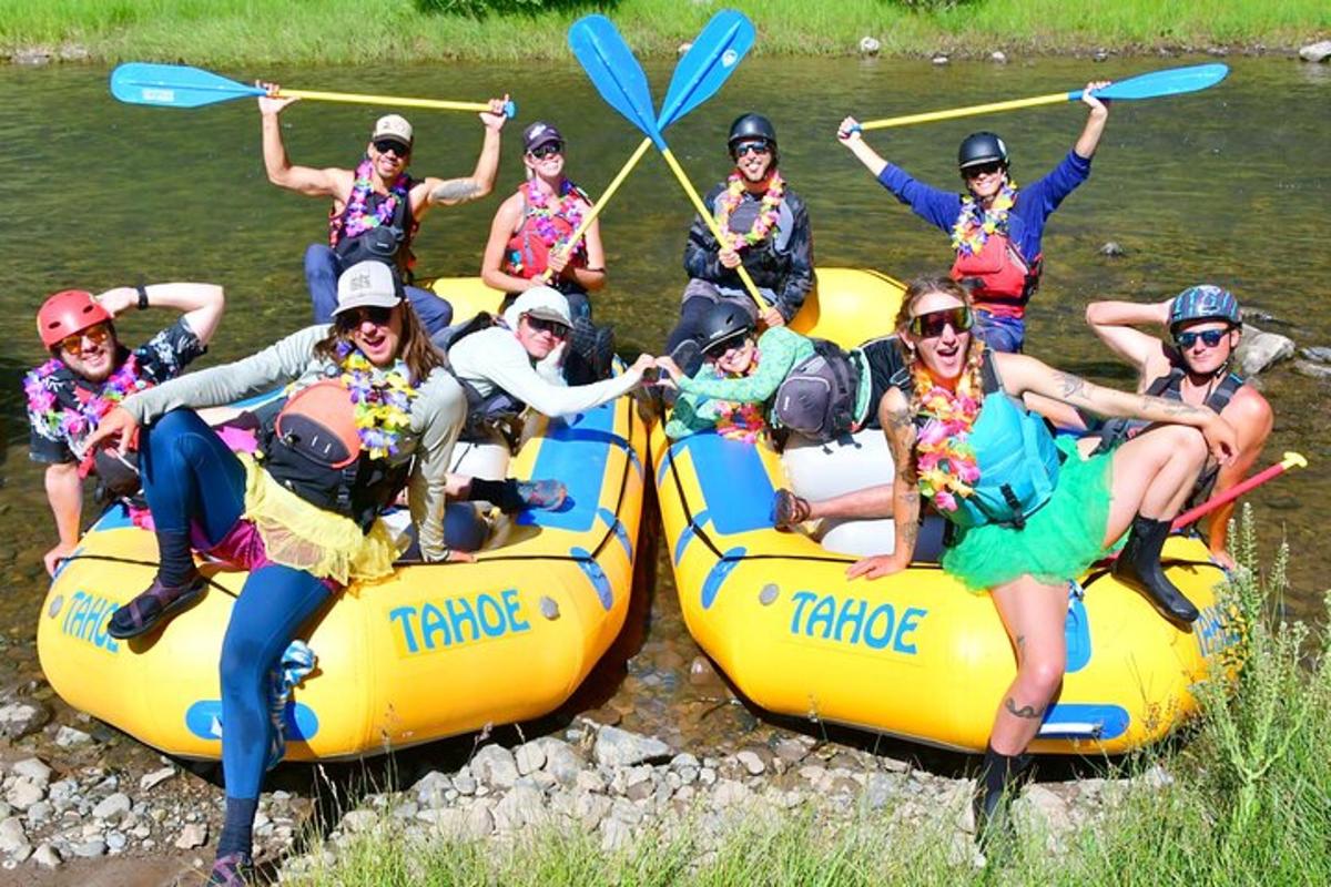 a group of people on rafts on a river