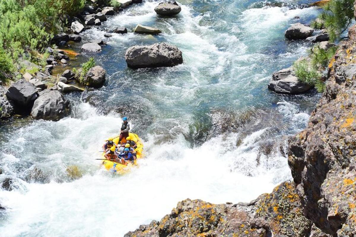 a person in a raft in a river