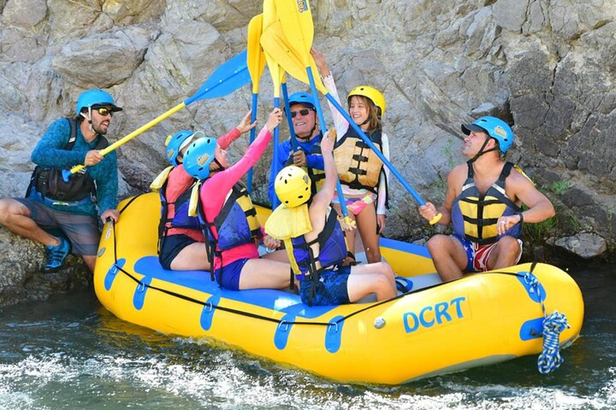 a group of people on a raft in the water