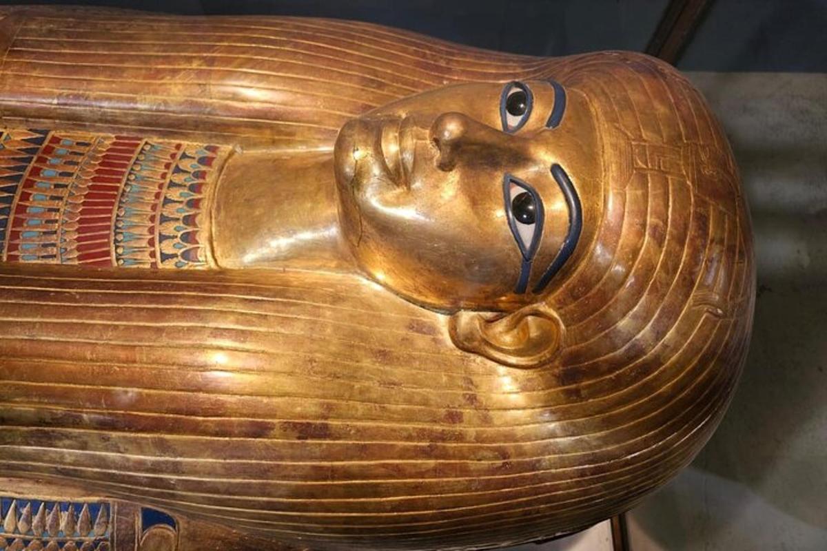 a wooden object with a face on top of it