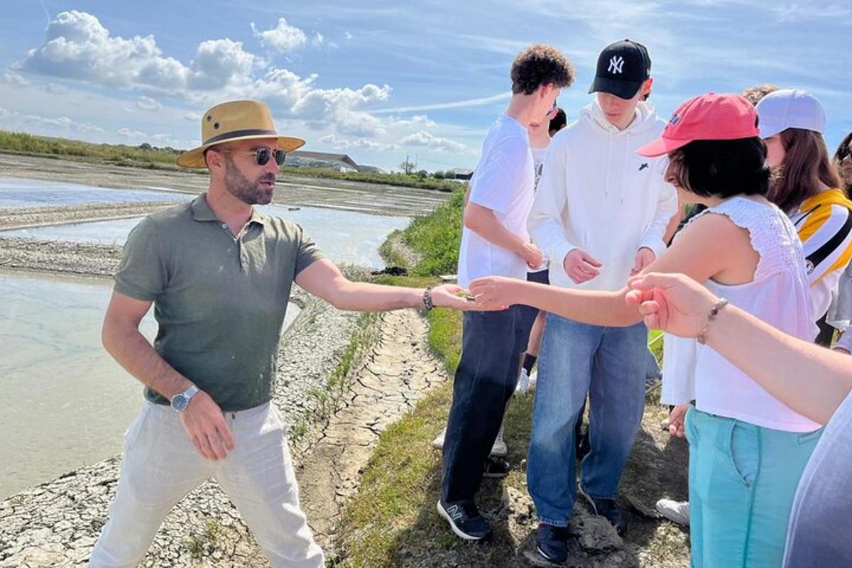 a group of people shaking hands near the water