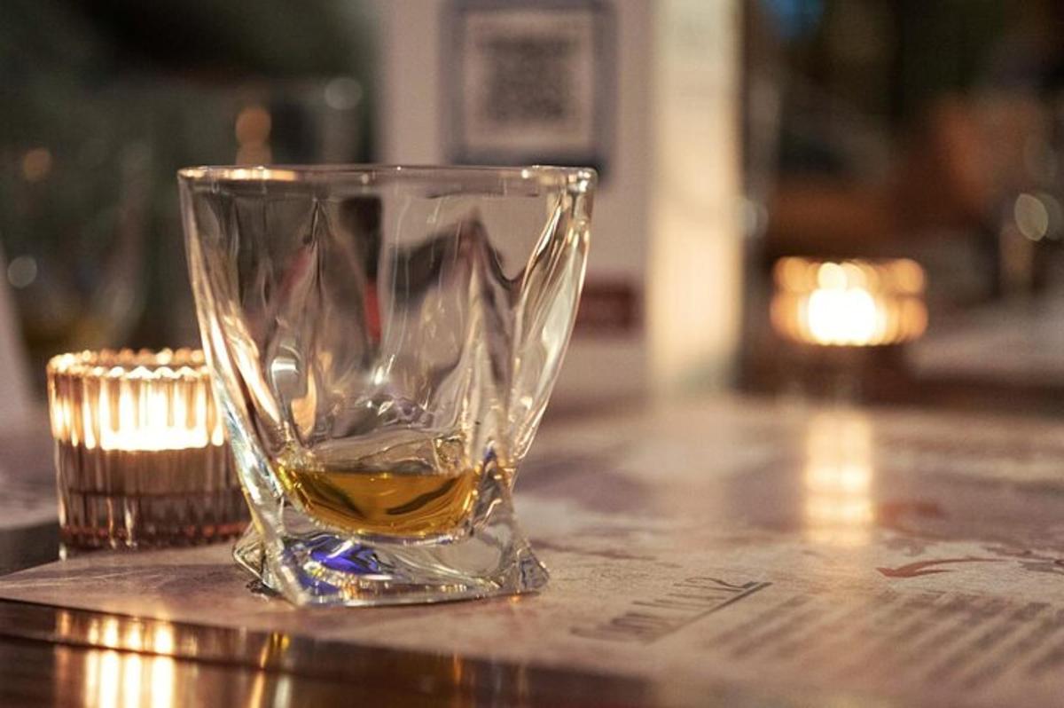 a glass cup sitting on top of a table
