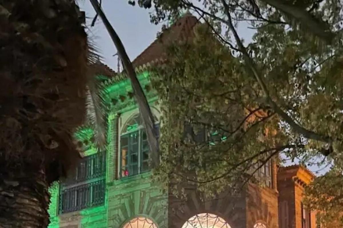 a building with green lights on it