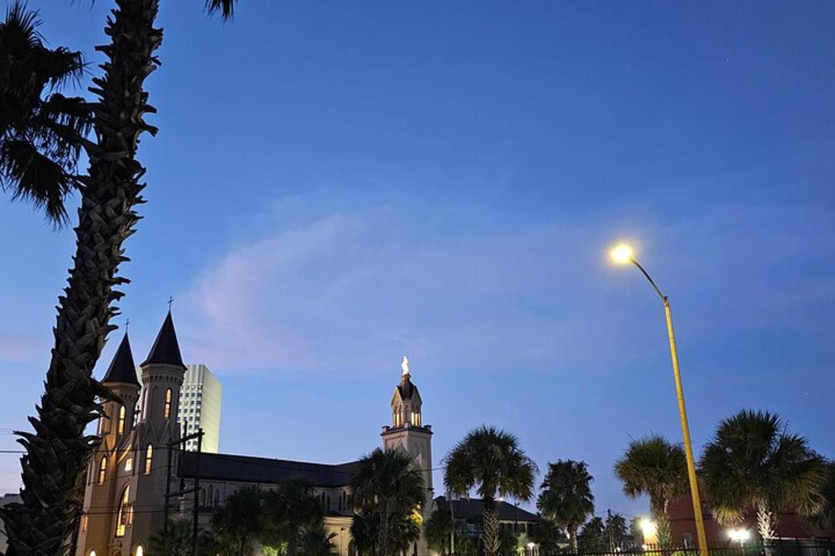 a building with a clock tower and a street light