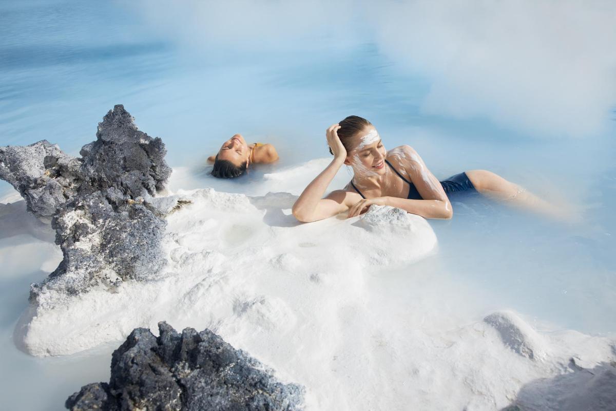 two people laying in the bath in the water