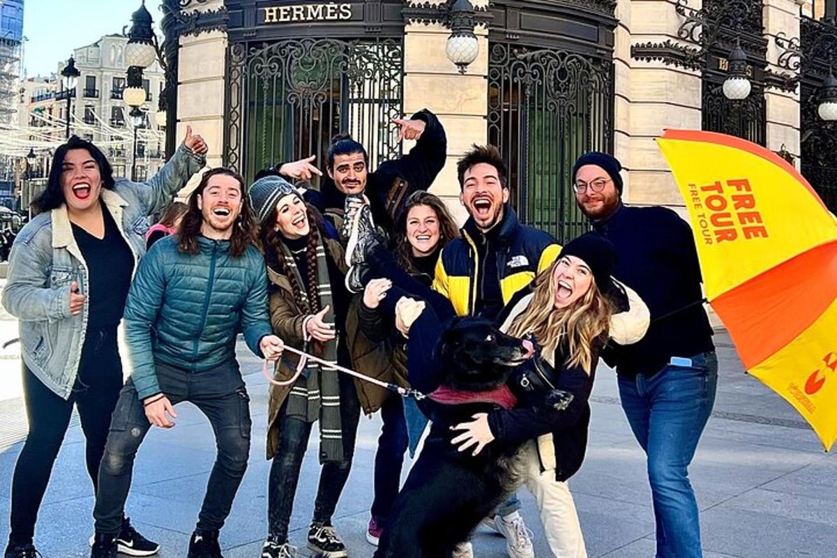 a group of people posing for a picture with a dog