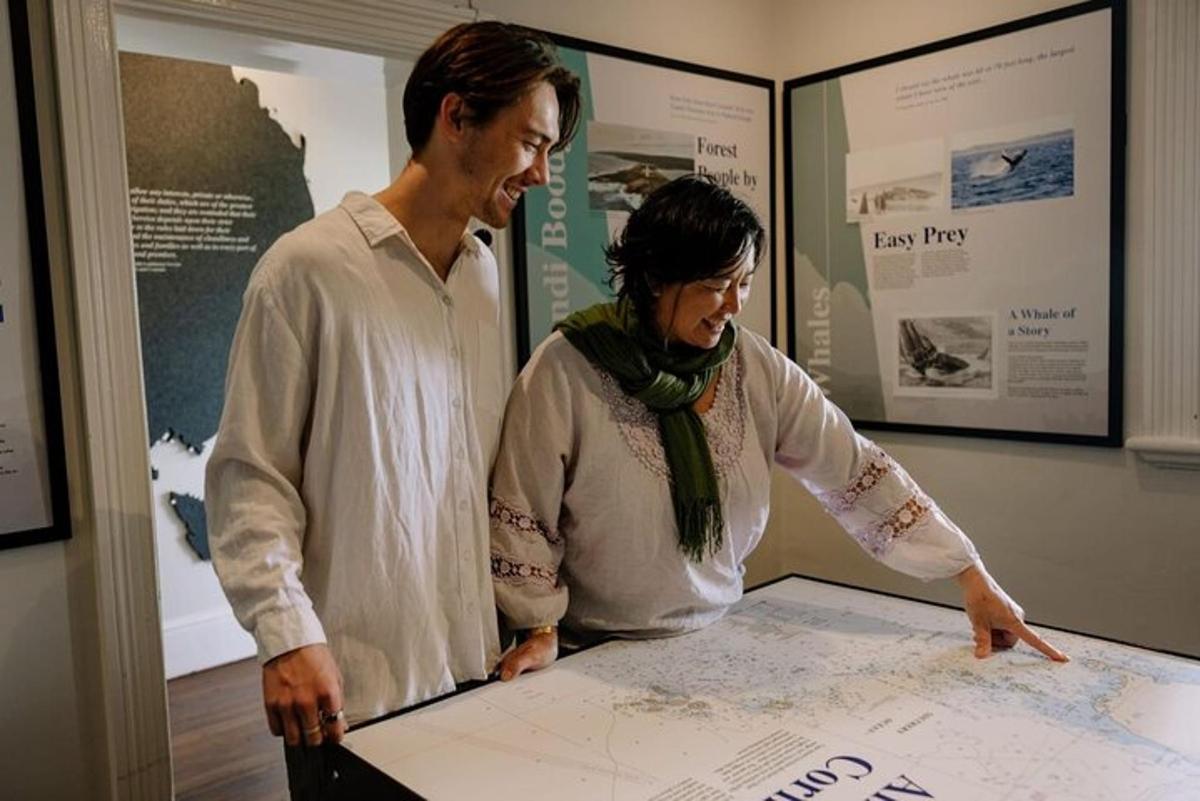 a man and a woman looking at a map