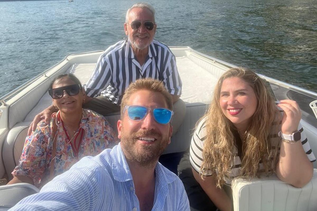 a group of people on a boat in the water