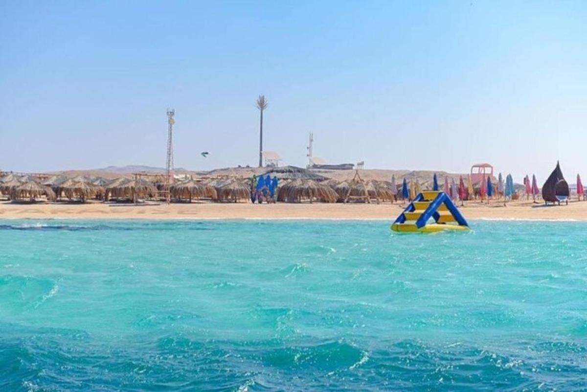 a yellow object in the water next to a beach