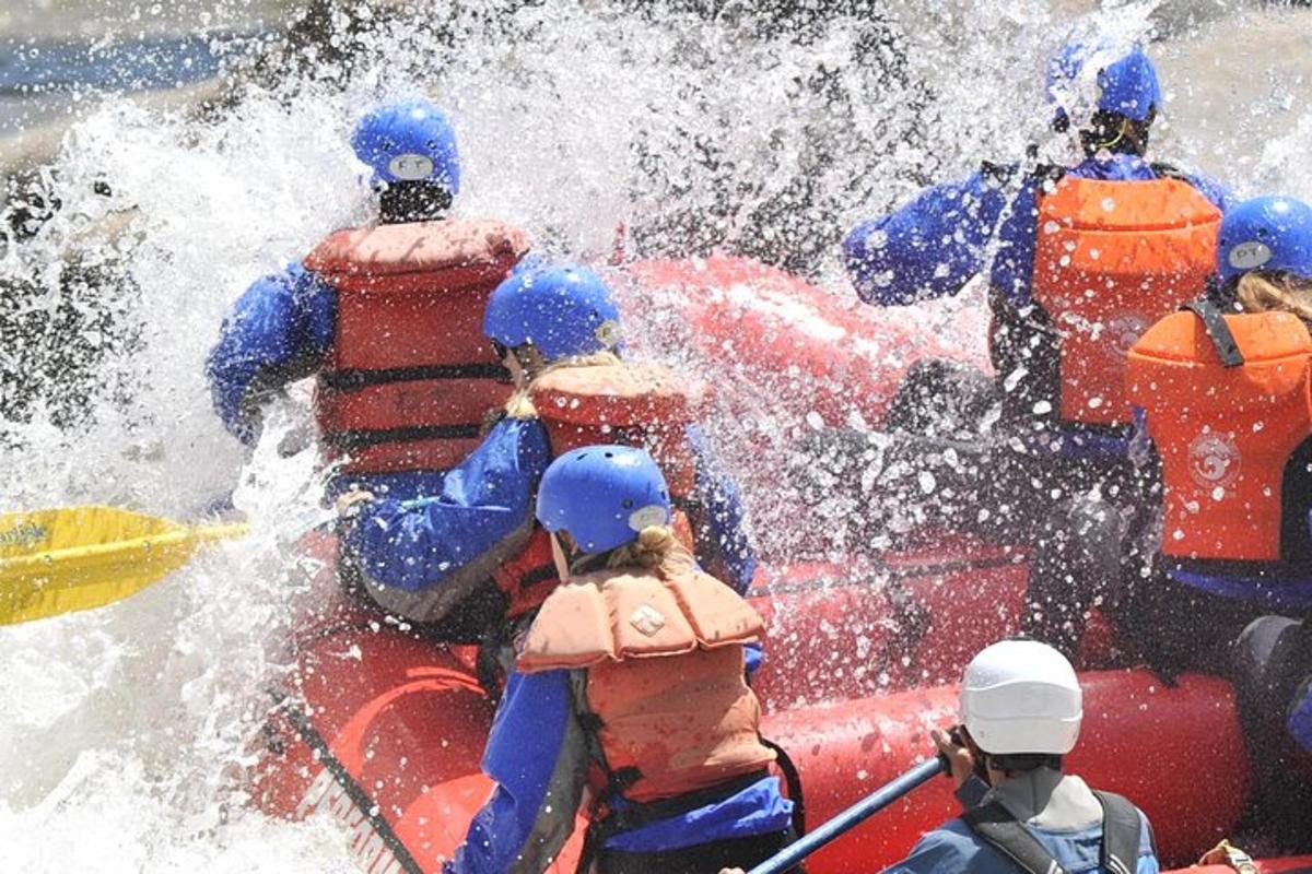a group of people on a raft in a river