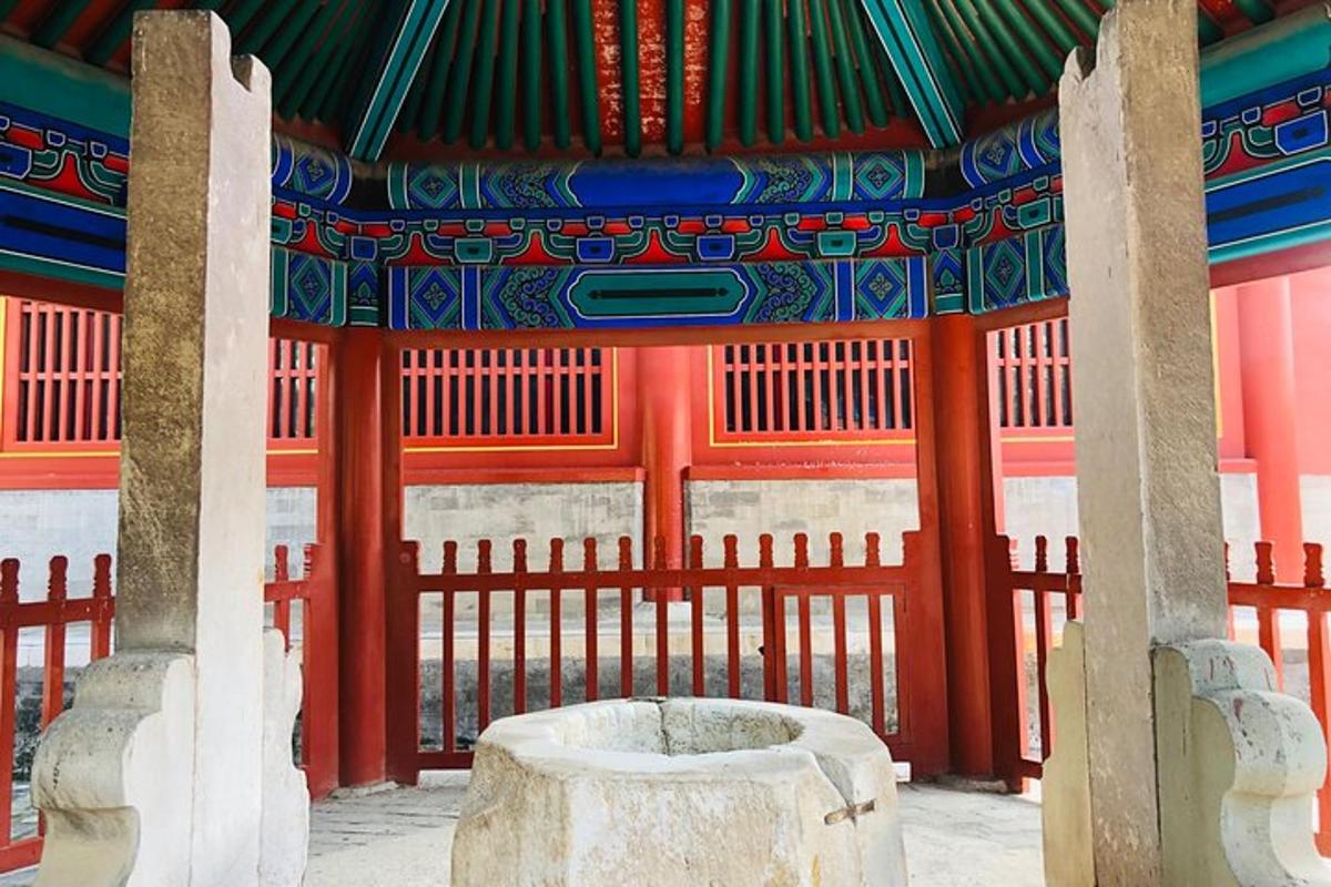 an entrance to a building with a gate and a pillar