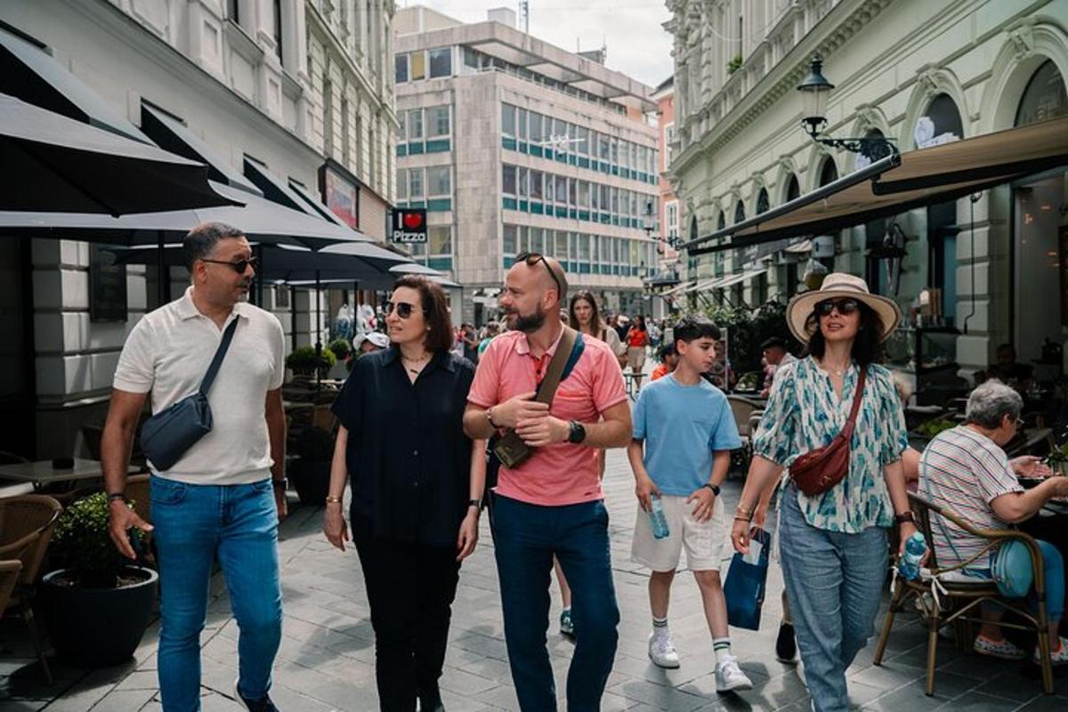 a group of people walking down a city street