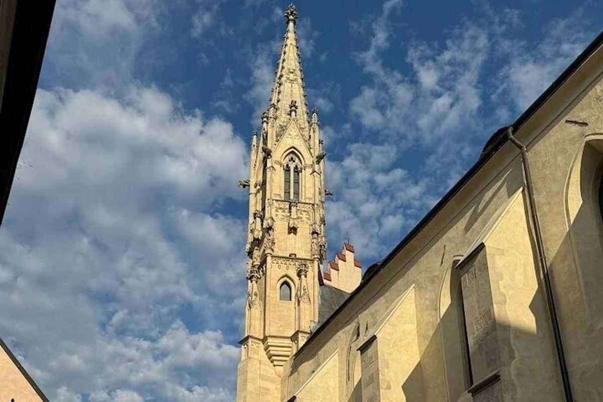 a tall tower with a steeple on top of a building