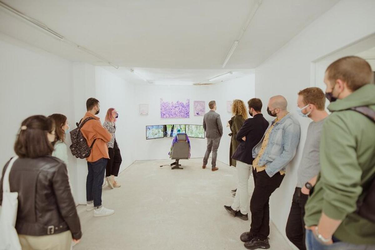 a group of people standing in an art exhibit