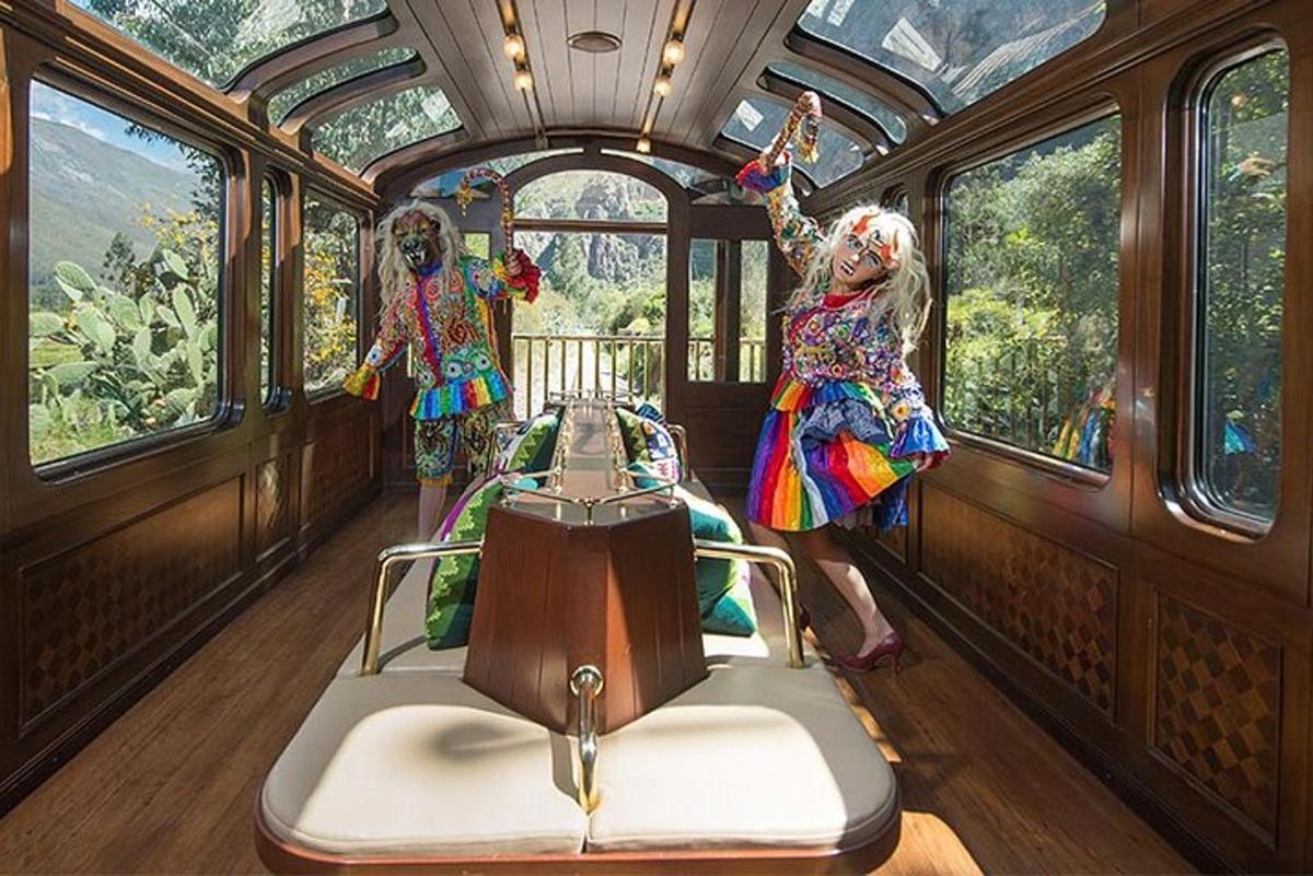 two people in costumes are riding on a train
