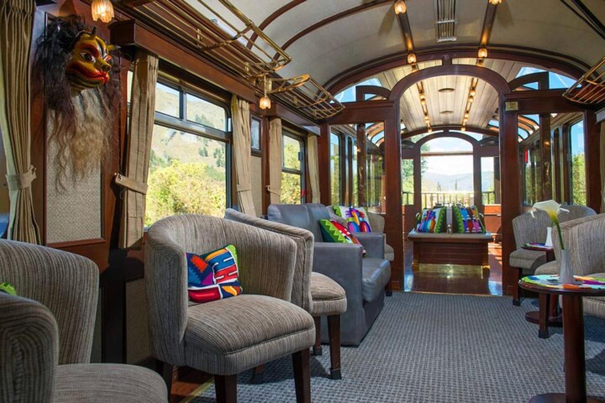 a train car with chairs and tables and windows