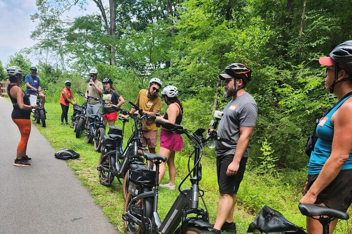 a group of people standing next to their bikes