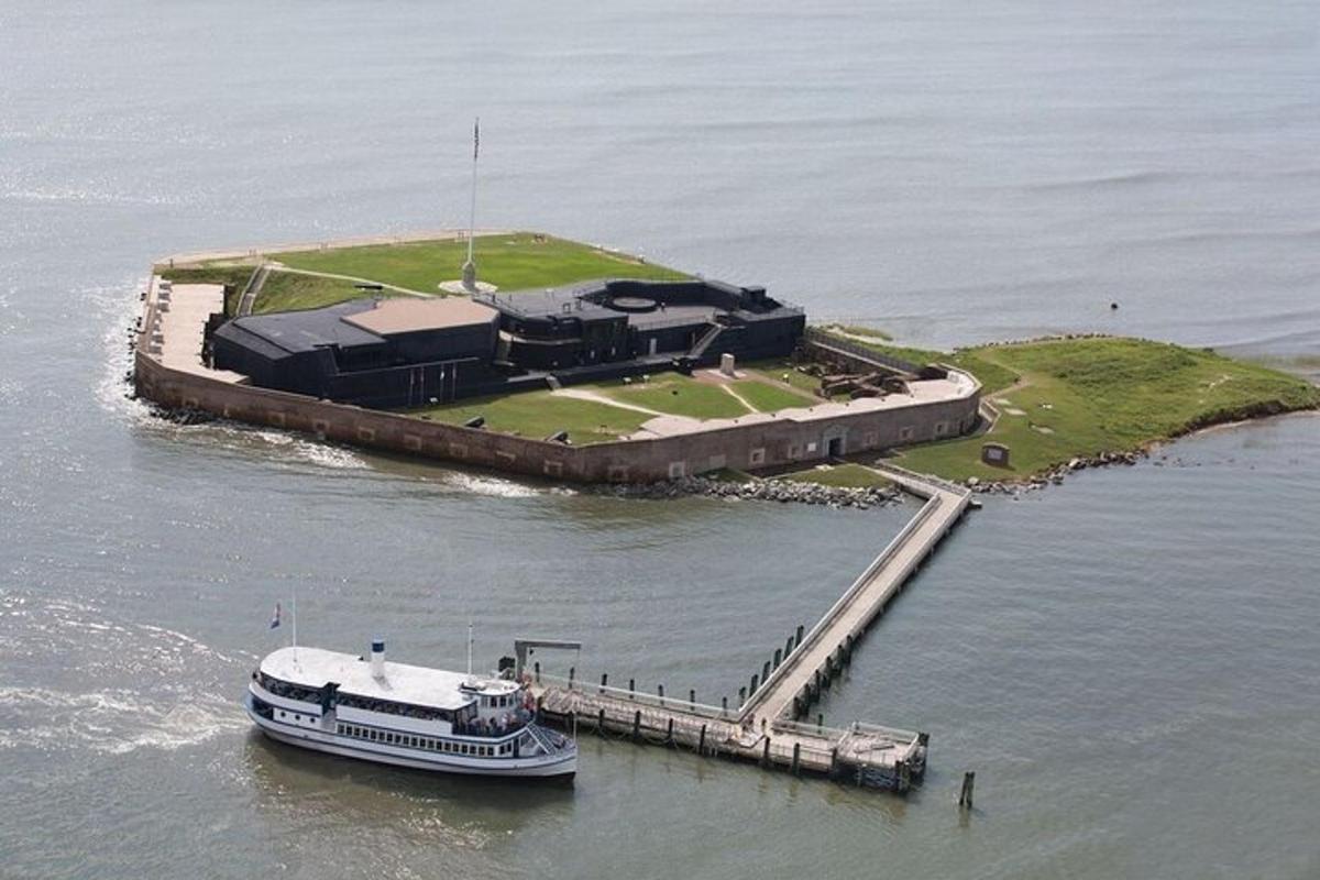 a boat is docked on an island in the water