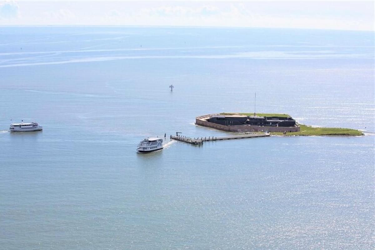 two boats are docked on an island in the water