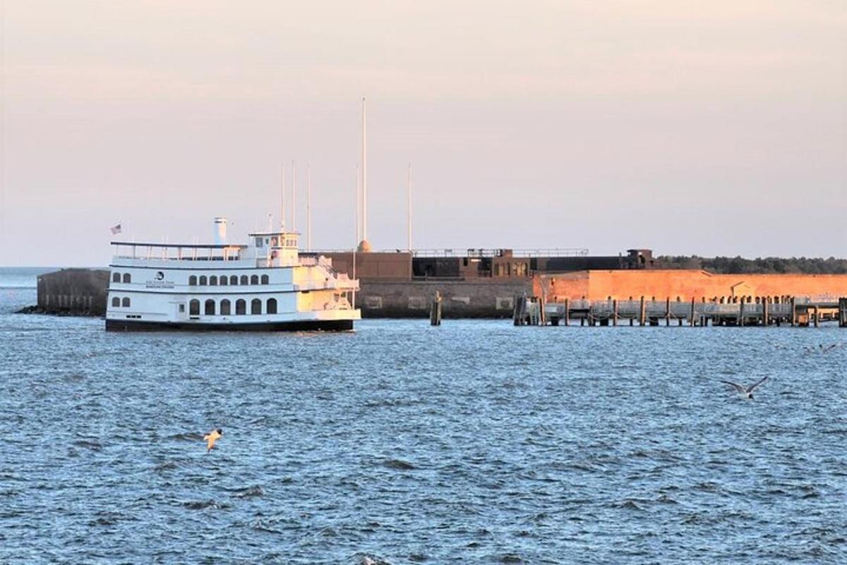 a large boat in the water near a dock