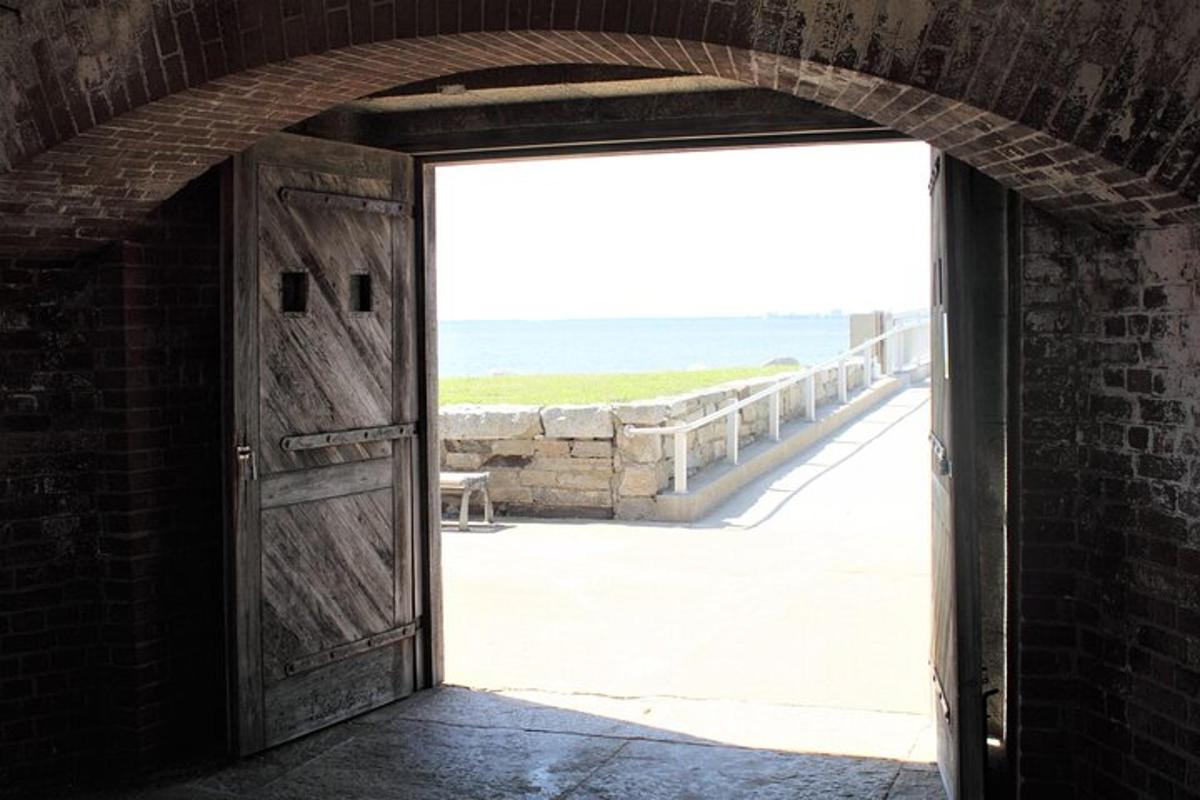 an open door with a view of the beach