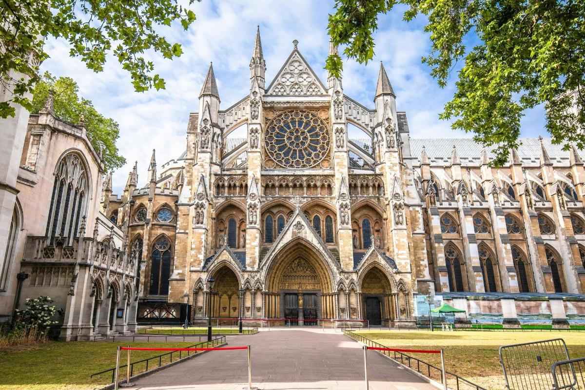 a cathedral with a large building with a clock tower