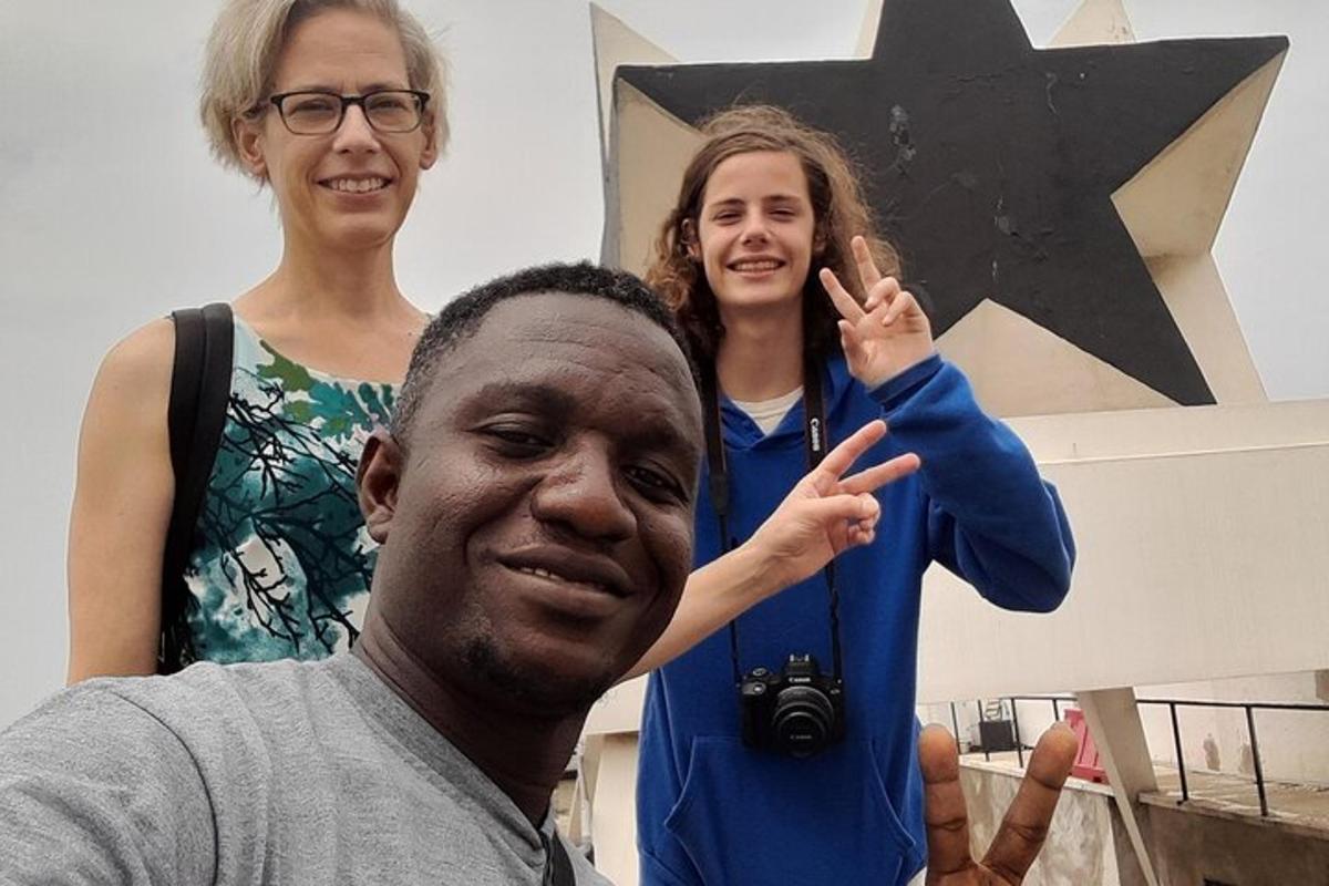 a man and two women posing for a picture