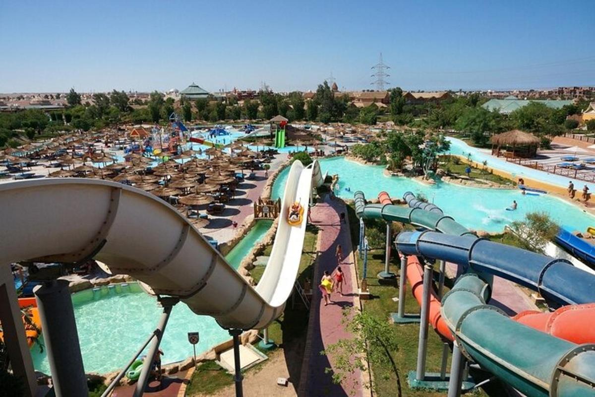 a water park with a water slide and people in it