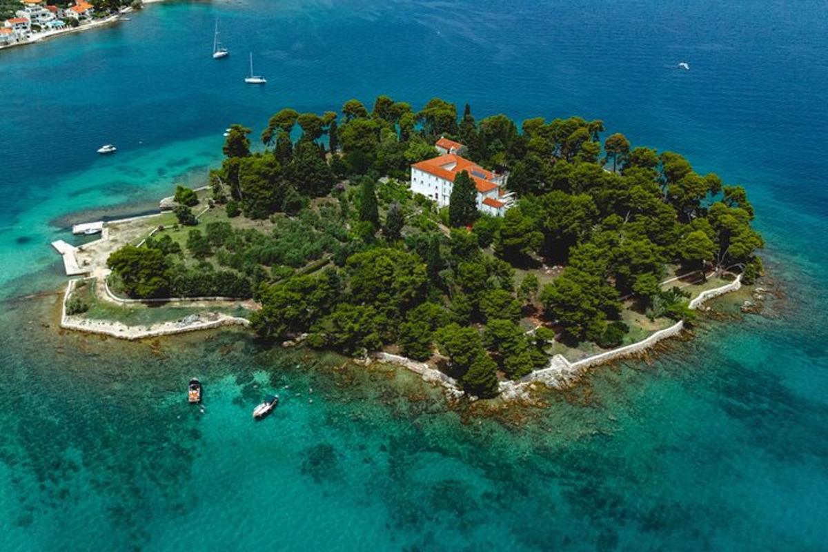 an island in the water with a house on it