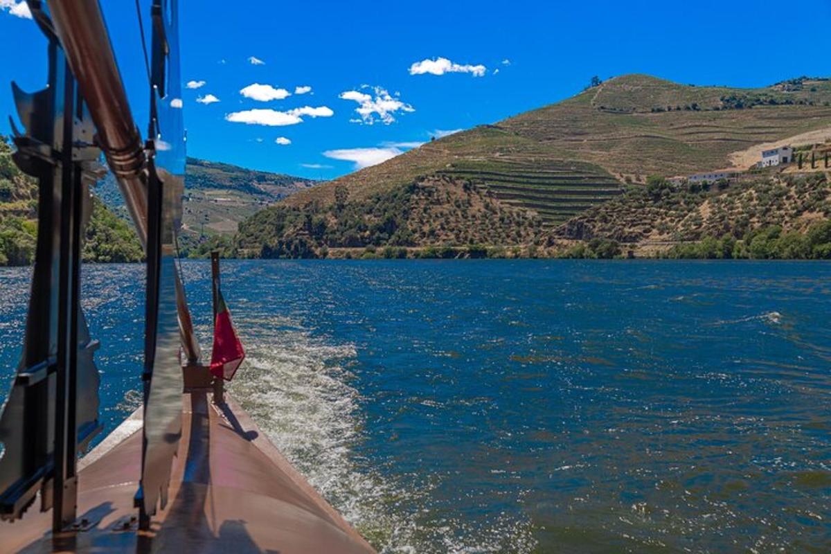 a boat on a lake with hills in the background