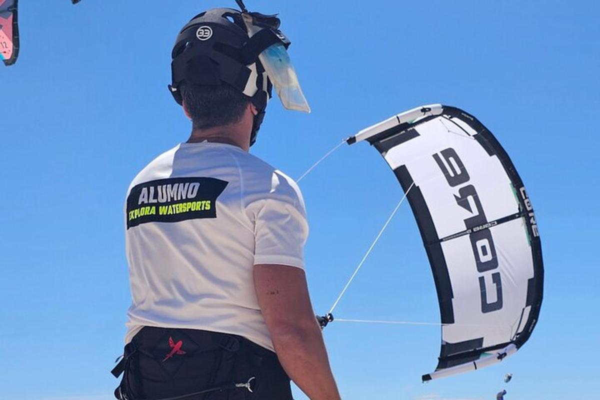 a man is flying a kite in the sky