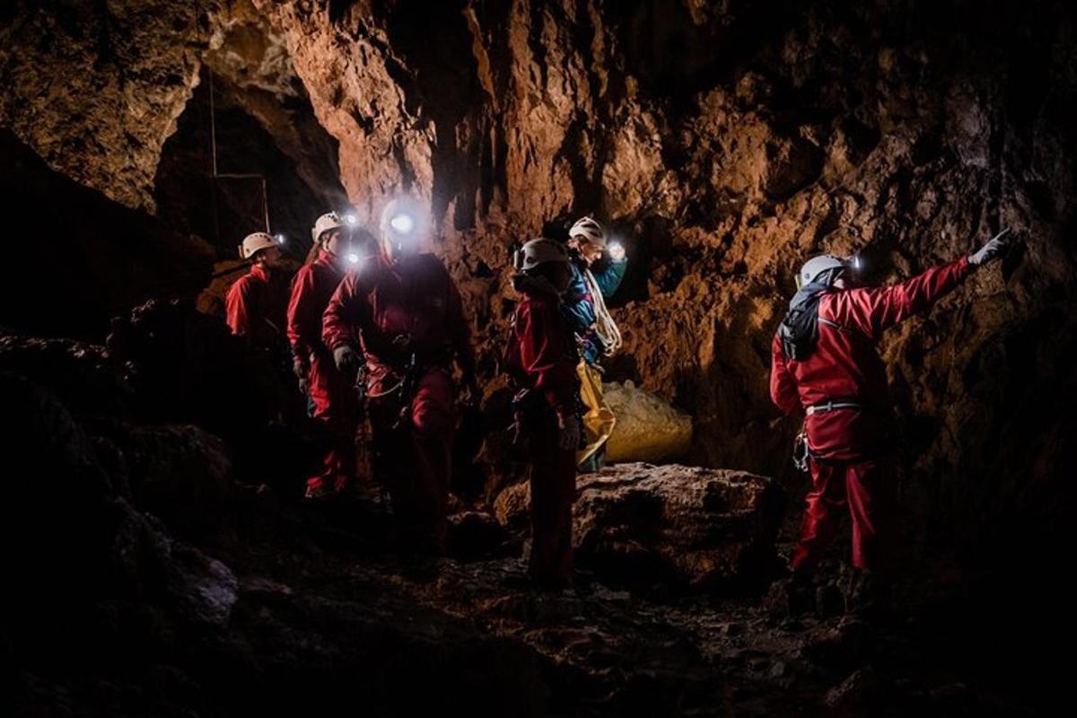 a group of people standing in a cave