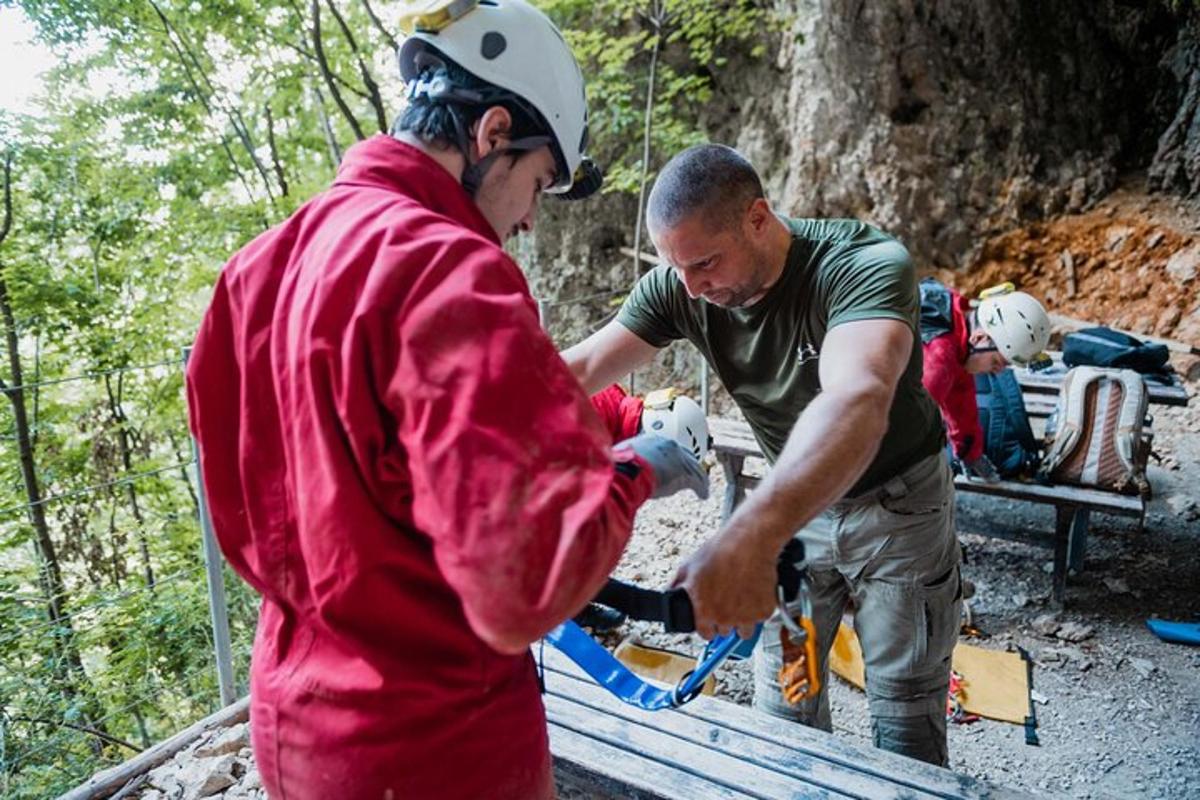 two men are working on a fire hydrant