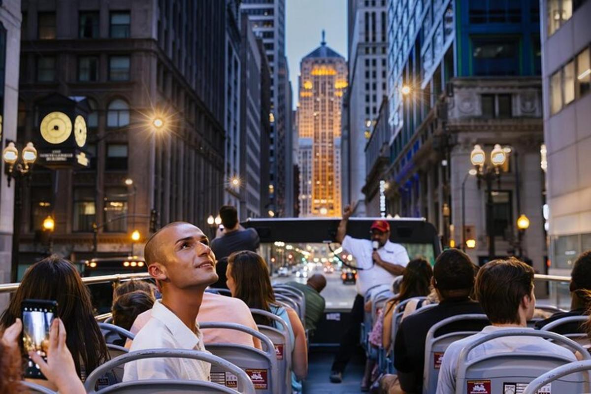 a group of people sitting on a bus in a city
