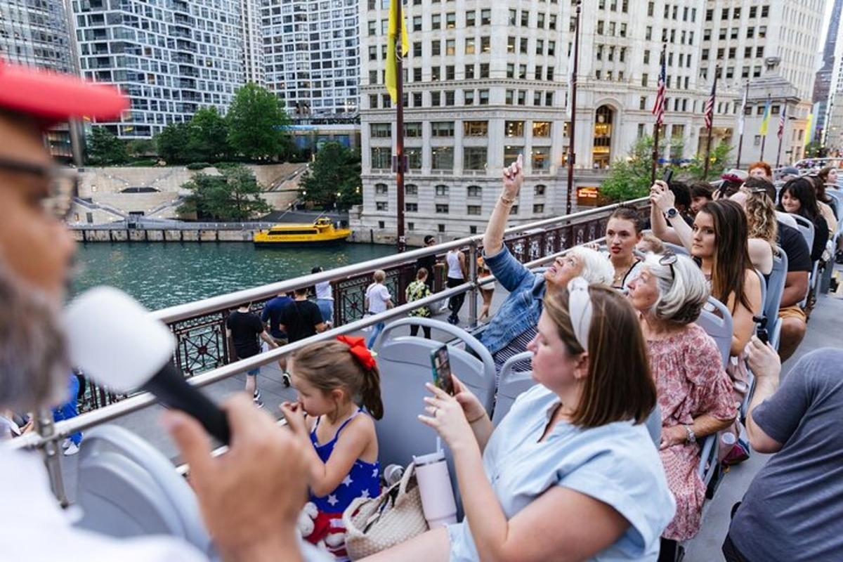 a group of people on a boat with their hands in the air