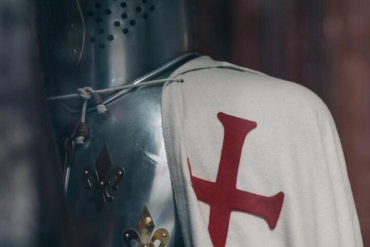 a white shirt with a red cross on it