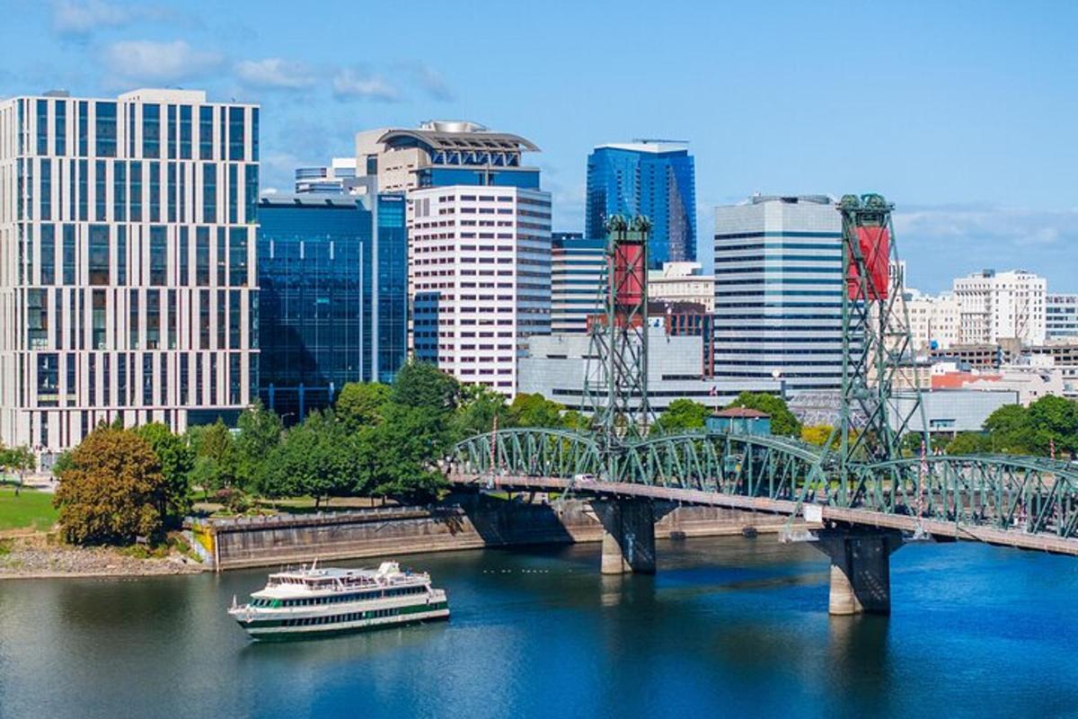 a bridge over a river with a boat in a city