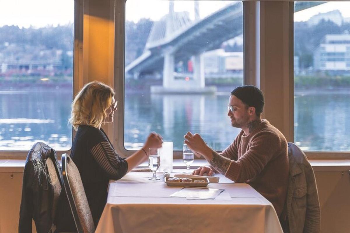 a man and woman sitting at a table in a restaurant