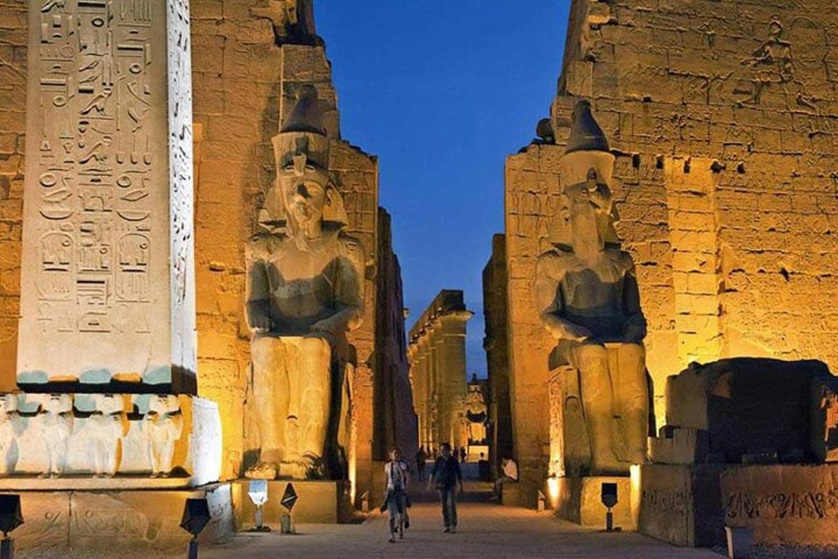 a building with two statues of people in it
