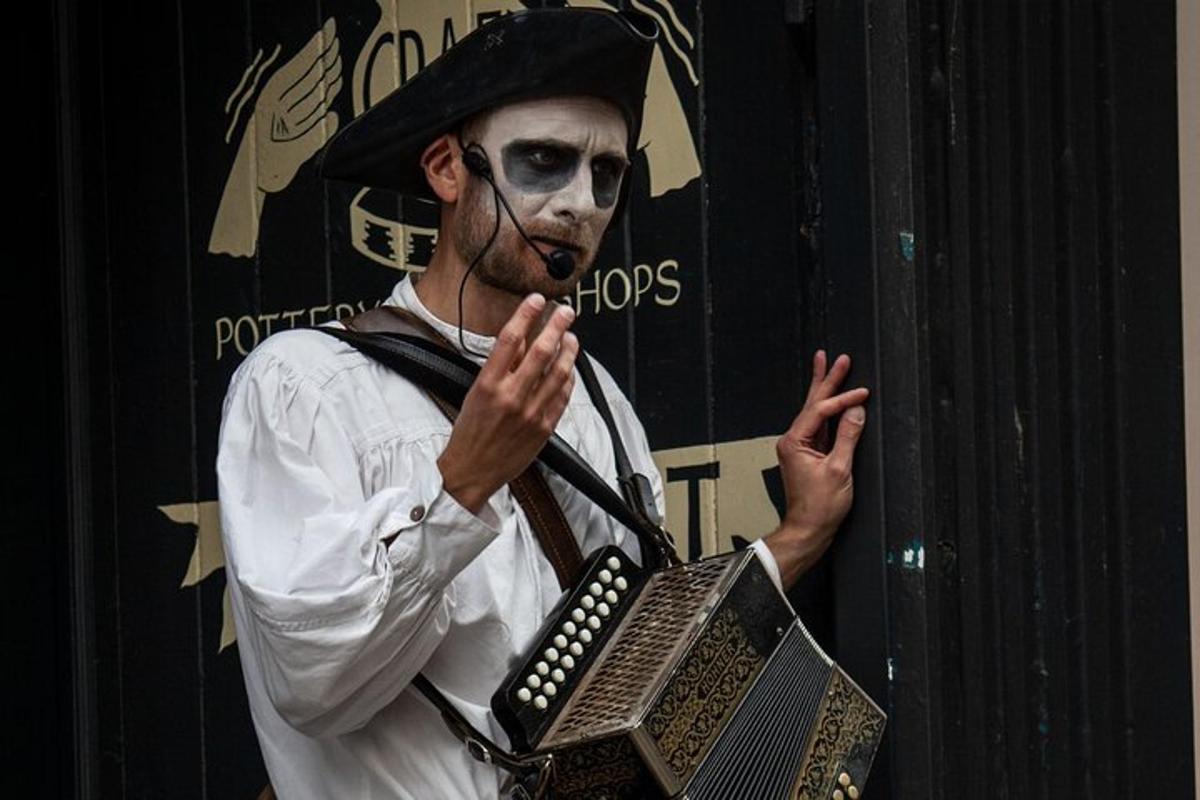 a man dressed up as a clown holding a laptop